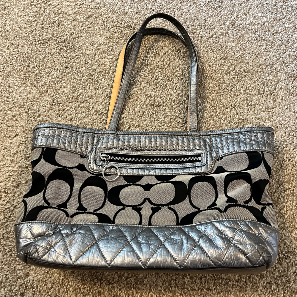 Used black and silver coach purse
